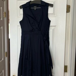White House Black Market navy dress size 8p sleeveless with pockets.